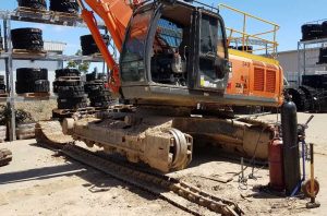 Excavator track being removed - Staying on top of your excavator’s maintenance