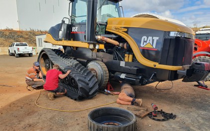 TKV working on a Cat Challenger 85e tractor