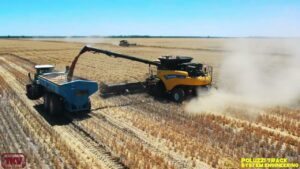 New Holland Combine Harvester wearing Poluzzi bolt on tracks